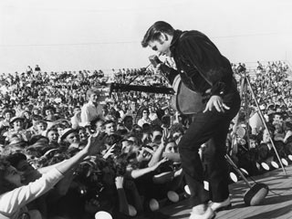 Elvis performing to a crowd